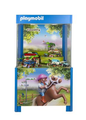 Coffret « Playmobil Country » avec cheval et cavalier dans une vitrine