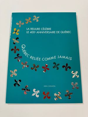 a blue book with a pattern of flowers on it