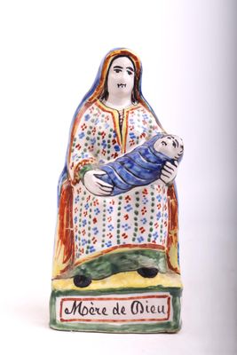 figurine of a woman holding a baby in her arms