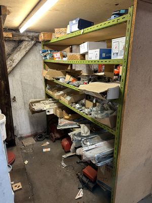 a room that has a bunch of shelves in it