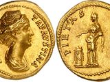 a gold coin with an image of a woman holding a sword