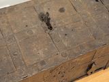an old wooden box sitting on top of a hard wood floor