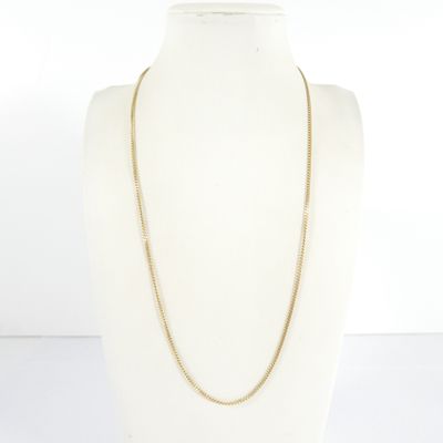 a close up of a mannequin torso with a necklace on it