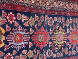 an oriental rug with many different colors and patterns