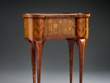 a small table with a drawer on one side and a drawer on the other side