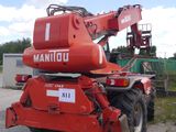 a red crane that is parked on the side of the road
