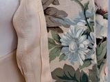 the back view of a woman ' s dress with a floral pattern on it