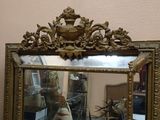 a mirror that is sitting on a table in a room