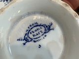 a white plate with a blue and white design on it