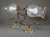 two lamps that are sitting on a table