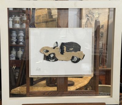 a picture of a picture of a car in a glass case