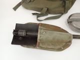 a bag with a gun inside of it and a knife in it