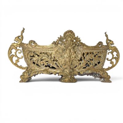 an antique brass planter on a white background with a white background