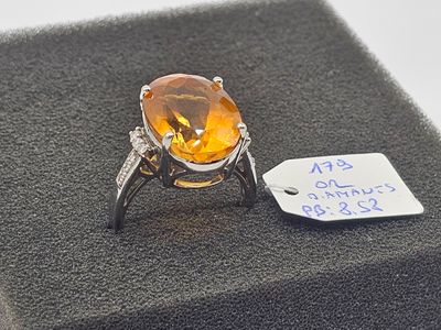 a ring with a citrine stone and a price tag