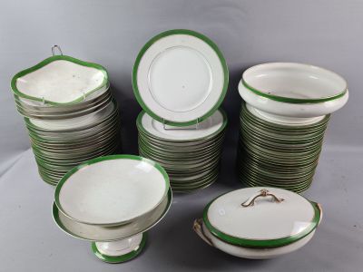 a lot of plates and bowls on the table