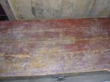 a wooden box that has a metal lid on it