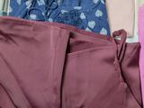 a suit case filled with clothes and a pair of socks