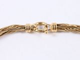 a gold bracelet with a clasp and a clasp clasp