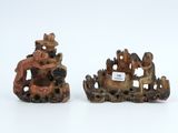 pair of chinese carved figurines of a man and a woman on a boat