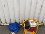 a fire hydrant and a hose on the side of a building