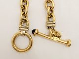two pairs of gold chains with a ring and a key