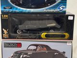 two boxed boxes of toy cars sitting on top of each other