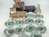 many cups and saucers that are sitting on a table