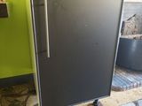 an image of a black refrigerator in a kitchen