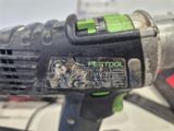 a close up of a corded drill on a table