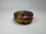a picture of a wooden box with a painting on it