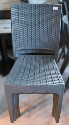 a grey chair that is sitting on a wooden table