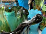many vases that are sitting on a table