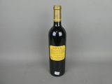 a bottle of wine that is sitting on a table