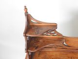 a wooden bed with a wooden headboard and foot board
