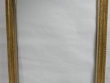a gold picture frame with a white background
