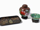 a small vase and a small bowl on a table