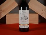 a bottle of wine that is sitting on a table