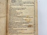 an open book with a page of text on it sitting on a table
