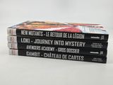 three books stacked on top of each other on a white surface