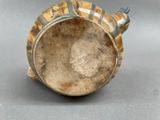 a close up of a vase on a table