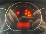 a close up of a car dashboard with a speedometer