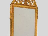 an image of a mirror with a gold frame on a white background