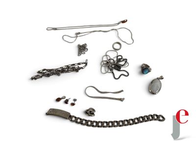 a lot of jewelry that is laying out on a white surface