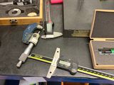 a table with tools on it that are sitting on a table