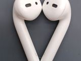 two white airpods sitting next to each other on top of a table