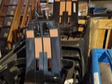 many chairs that are stacked up in a room