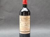 a bottle of wine that is sitting on a table