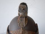 a helmet with a bird on top of it