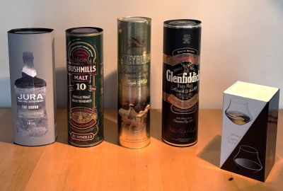 several different types of cans are lined up on a table