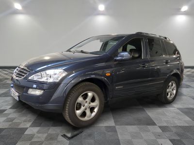 a picture of a blue suv parked in a garage